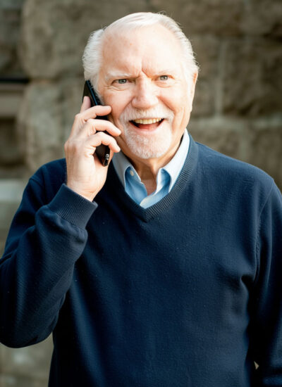 David A. Shean standing while on the phone.